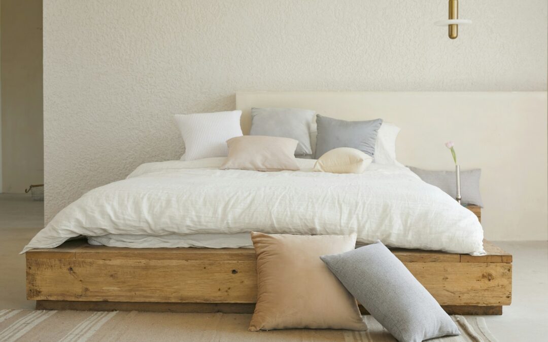 white bed pillow on brown wooden bed frame