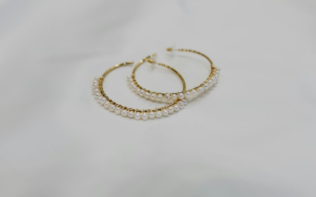 gold bracelet on white textile